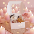 Love Spell Gift Box with Body Oil, Body Butter, and Bar Soap in a warm romantic spa setting